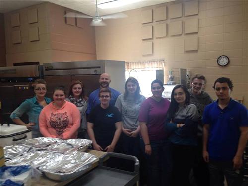 Service Learning and Foods Class cooking dinner for Tambo Apartments 