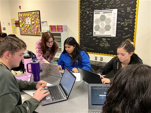  English teacher Corissa Beck, seniors Cesia Argueta, Zakiyah Williams, and Dante Bolds
