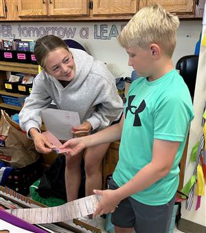  Tiger Tutor Kennedy Woolery works with Skyline Elementary student Wyatt Pierce